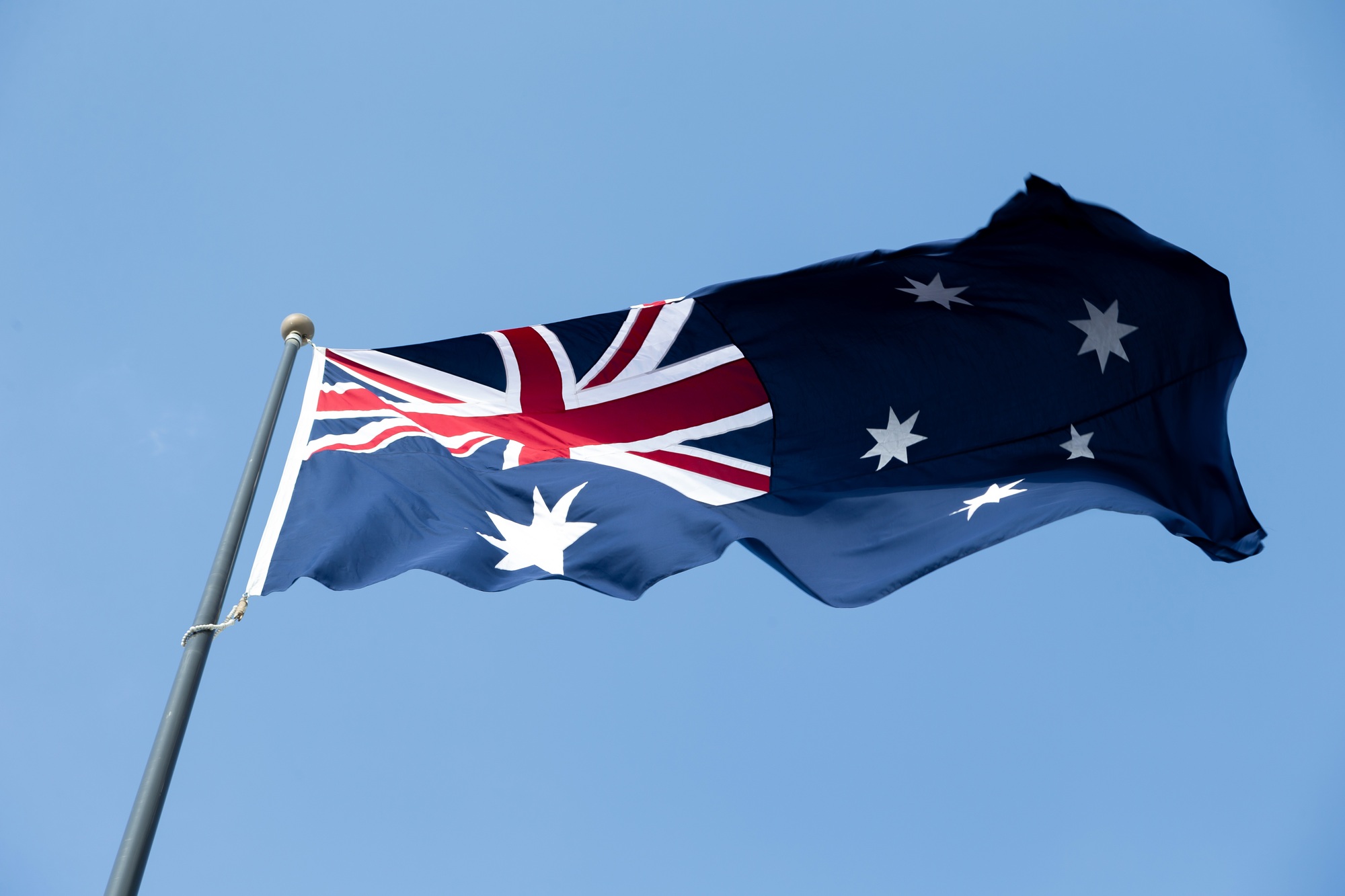 Australian flag against blue sky